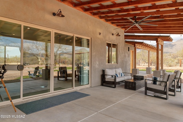 view of patio / terrace featuring a mountain view and an outdoor hangout area