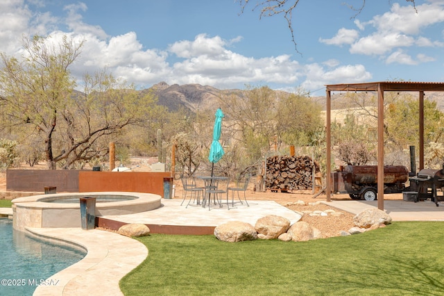 view of yard featuring a patio, fence, a fenced in pool, and an in ground hot tub