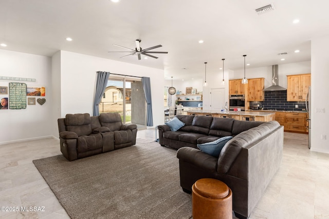 living room with visible vents, ceiling fan, recessed lighting, and baseboards
