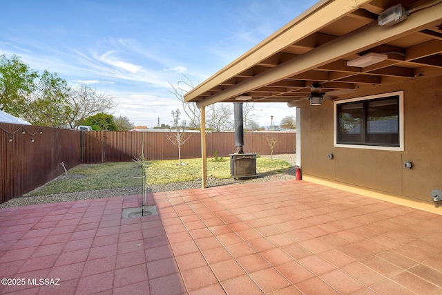 view of patio featuring a fenced backyard and a ceiling fan