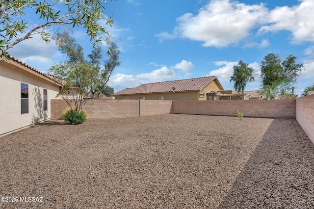 view of yard with a fenced backyard