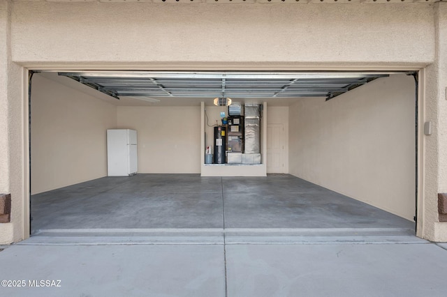 garage with heating unit and electric water heater
