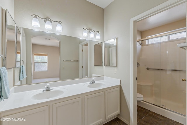 2525 N Camino Reloj, Green Valley, AZ 85614 - full bath featuring toilet, a shower stall, double vanity, and tile patterned flooring