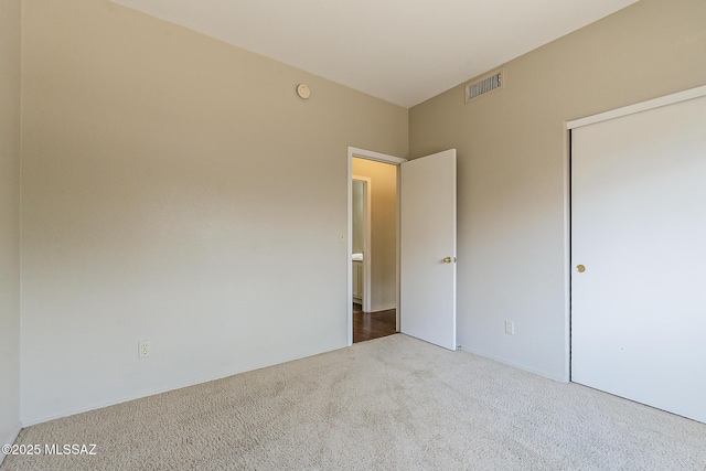 2525 N Camino Reloj, Green Valley, AZ 85614 - unfurnished bedroom featuring carpet floors and a closet