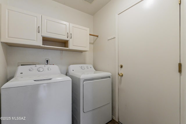 2525 N Camino Reloj, Green Valley, AZ 85614 - clothes washing area with cabinet space and washing machine and dryer