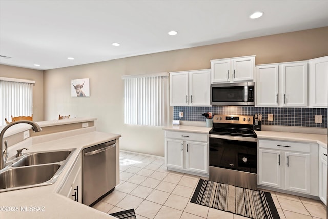 33743 S Ballad Dr, Red Rock, AZ 85145 - kitchen featuring tasteful backsplash, appliances with stainless steel finishes, light tile patterned floors, and a sink