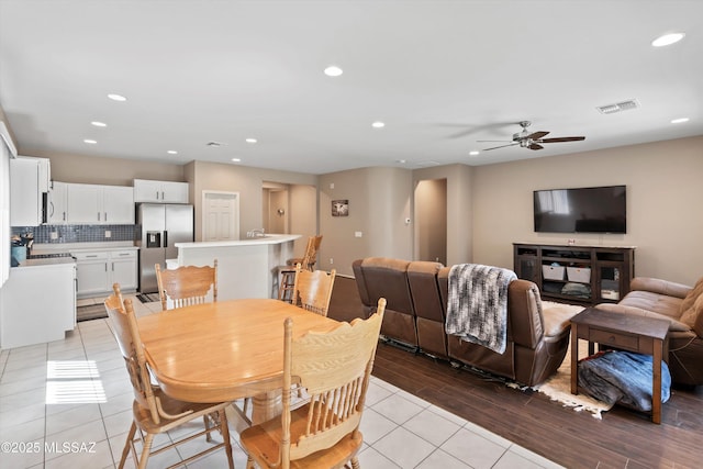 33743 S Ballad Dr, Red Rock, AZ 85145 - dining room featuring light wood-style floors, recessed lighting, visible vents, and ceiling fan