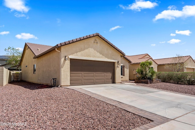 33743 S Ballad Dr, Red Rock, AZ 85145 - mediterranean / spanish-style home with a tiled roof, concrete driveway, a garage, and stucco siding