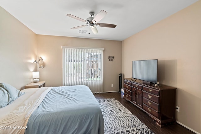 33743 S Ballad Dr, Red Rock, AZ 85145 - bedroom with dark wood-type flooring, visible vents, baseboards, and ceiling fan