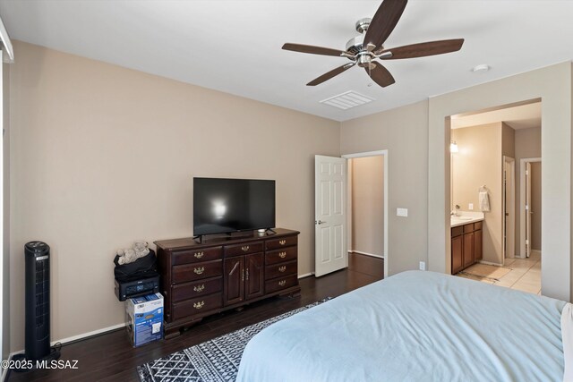33743 S Ballad Dr, Red Rock, AZ 85145 - bedroom with ensuite bathroom, baseboards, a sink, a ceiling fan, and wood finished floors