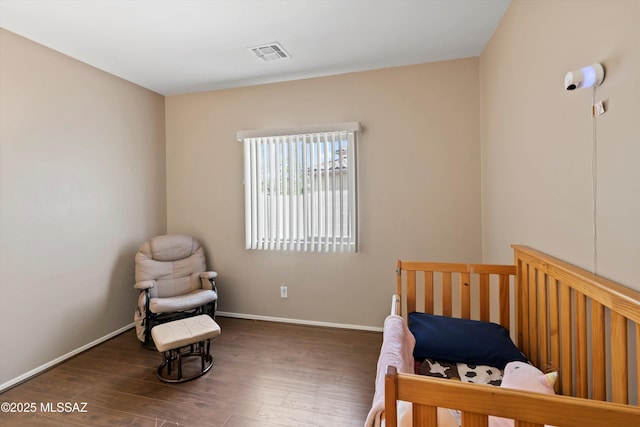 33743 S Ballad Dr, Red Rock, AZ 85145 - bedroom with wood finished floors, baseboards, and visible vents