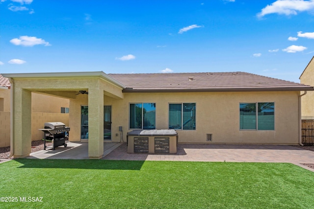 33743 S Ballad Dr, Red Rock, AZ 85145 - back of property with stucco siding, a patio area, a yard, a tiled roof, and fence