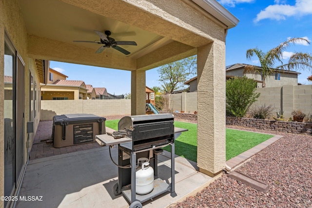 33743 S Ballad Dr, Red Rock, AZ 85145 - view of patio with a ceiling fan, area for grilling, a fenced backyard, a hot tub, and a playground