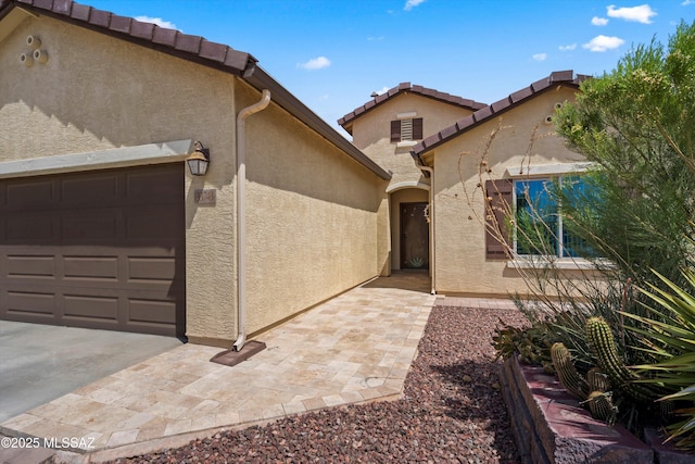 33743 S Ballad Dr, Red Rock, AZ 85145 - view of front of home with stucco siding and an attached garage