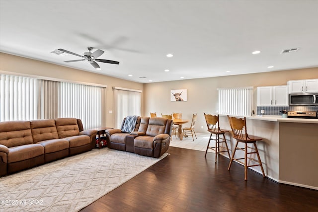 33743 S Ballad Dr, Red Rock, AZ 85145 - living area with recessed lighting, visible vents, ceiling fan, and wood finished floors