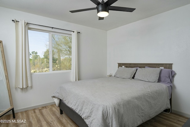 2301 W Montrose Pl, Tucson, AZ 85741 - bedroom featuring a ceiling fan, baseboards, and wood finished floors