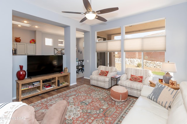 living area with ceiling fan, recessed lighting, baseboards, and wood finished floors