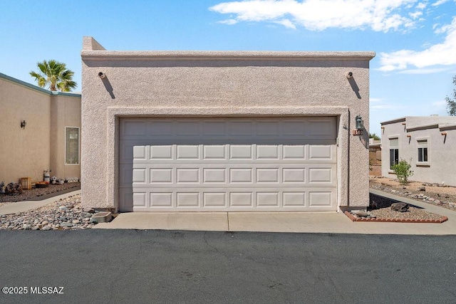 garage featuring driveway