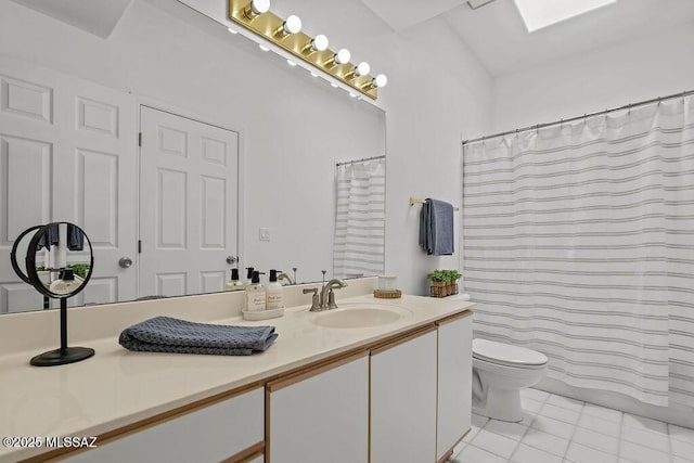 bathroom with toilet, tile patterned flooring, and vanity