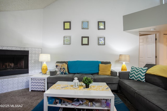living area featuring carpet flooring, vaulted ceiling, and a premium fireplace