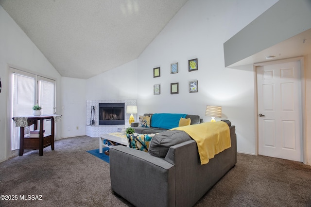 living area with carpet flooring, high vaulted ceiling, and a fireplace with raised hearth