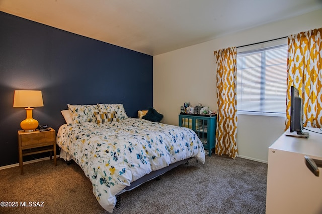 carpeted bedroom with baseboards
