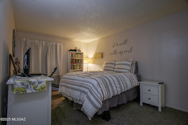 bedroom with carpet floors and a textured ceiling