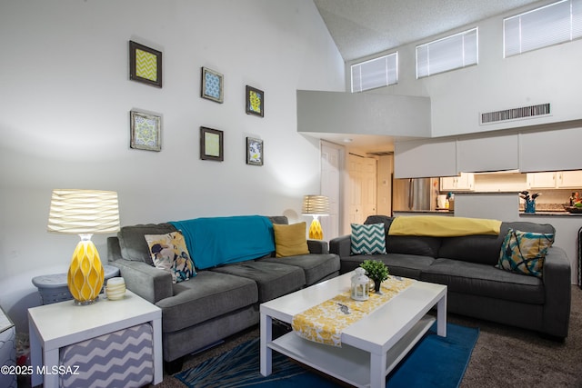carpeted living room with a towering ceiling and visible vents