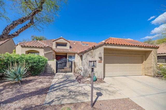 6091 N Golden Eagle Dr, Tucson, AZ 85750 - mediterranean / spanish house with an attached garage, a tile roof, stucco siding, a gate, and driveway