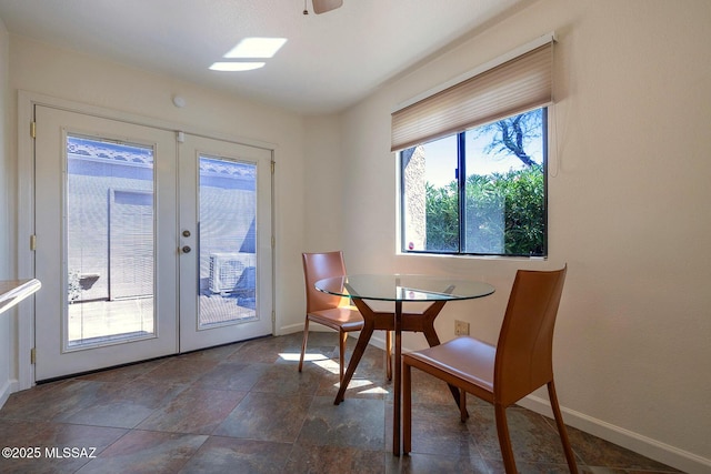 6091 N Golden Eagle Dr, Tucson, AZ 85750 - dining space with french doors and baseboards