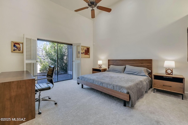 6091 N Golden Eagle Dr, Tucson, AZ 85750 - bedroom featuring ceiling fan, access to exterior, carpet flooring, and a high ceiling