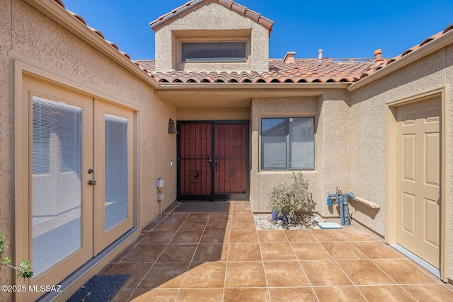 6091 N Golden Eagle Dr, Tucson, AZ 85750 - property entrance featuring french doors, stucco siding, and a tile roof