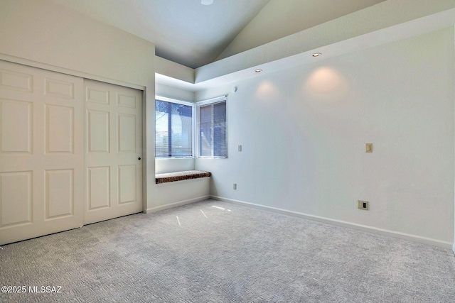 6091 N Golden Eagle Dr, Tucson, AZ 85750 - unfurnished bedroom featuring a closet, carpet flooring, baseboards, and lofted ceiling