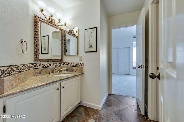6091 N Golden Eagle Dr, Tucson, AZ 85750 - bathroom with vanity and baseboards