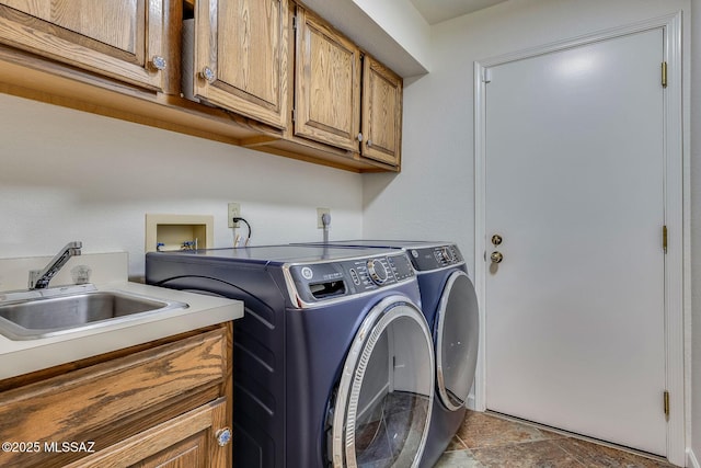 6091 N Golden Eagle Dr, Tucson, AZ 85750 - washroom with cabinet space, independent washer and dryer, stone finish floor, and a sink
