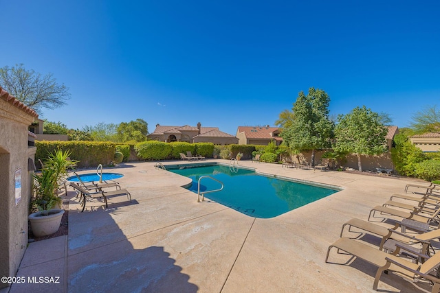 6091 N Golden Eagle Dr, Tucson, AZ 85750 - community pool featuring a patio area and fence