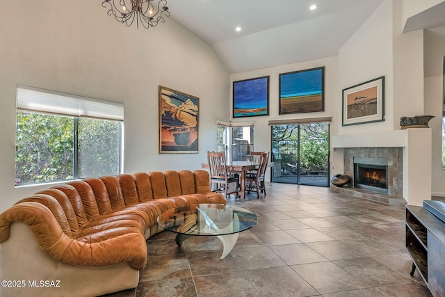 6091 N Golden Eagle Dr, Tucson, AZ 85750 - living room featuring high vaulted ceiling, a tiled fireplace, and recessed lighting