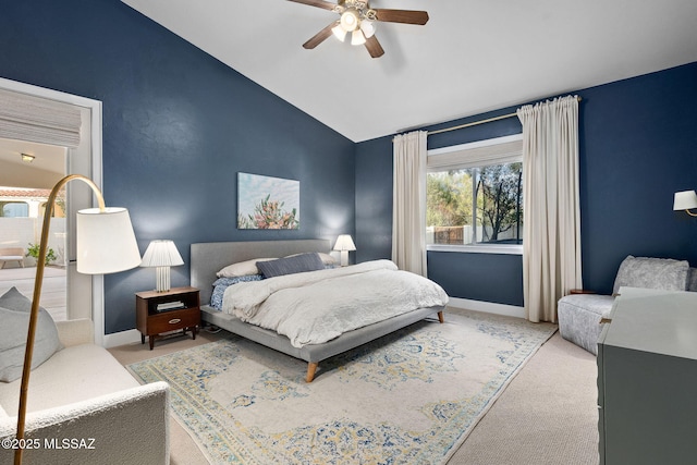 bedroom featuring carpet flooring, baseboards, vaulted ceiling, and ceiling fan