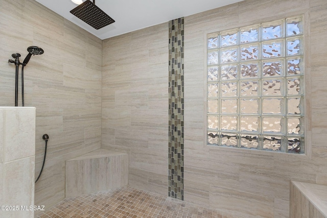 full bathroom with a tile shower