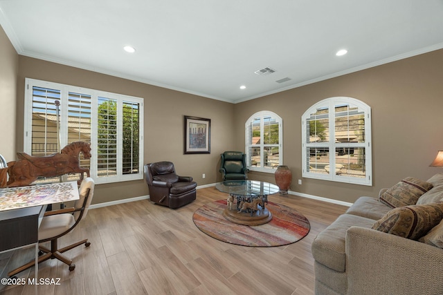 living room featuring a wealth of natural light, visible vents, recessed lighting, and crown molding