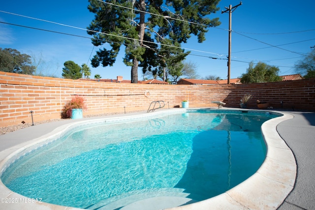 1838 N Campbell Ave, Tucson, AZ 85719 - view of pool featuring a fenced backyard, a fenced in pool, and a diving board