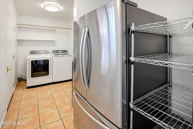 1838 N Campbell Ave, Tucson, AZ 85719 - laundry area with washer and clothes dryer, laundry area, and light tile patterned floors