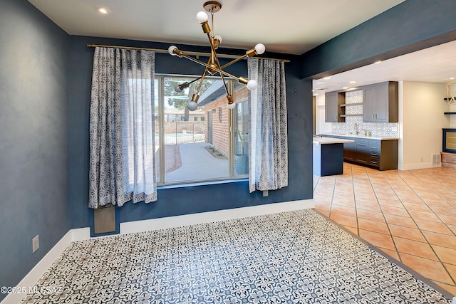 1838 N Campbell Ave, Tucson, AZ 85719 - unfurnished dining area featuring recessed lighting, light tile patterned floors, a notable chandelier, and a sink