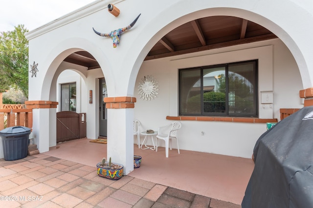 view of patio featuring a gate