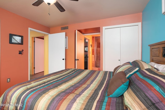 bedroom with a closet, ceiling fan, and visible vents