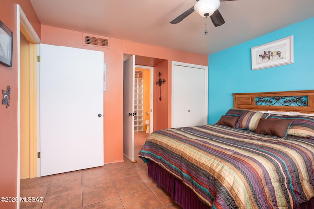tiled bedroom with visible vents and ceiling fan