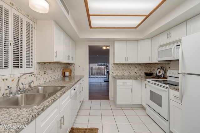 538 N Dodge Blvd, Tucson, AZ 85716 - kitchen with light tile patterned floors, a sink, decorative backsplash, and white appliances