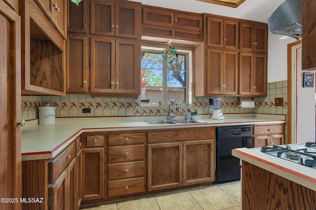 kitchen with dishwasher, light countertops, and a sink