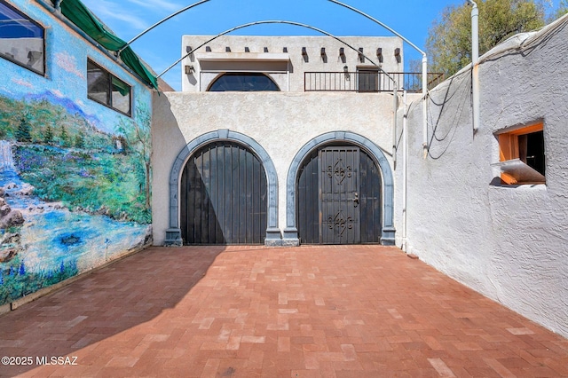 exterior space featuring stucco siding