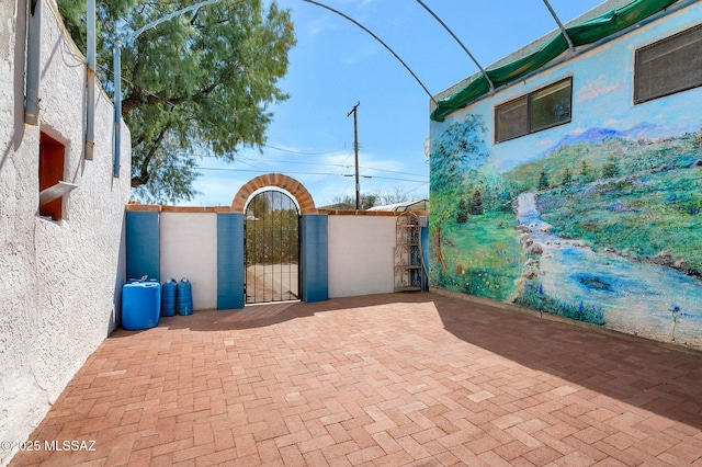 view of patio / terrace with a gate